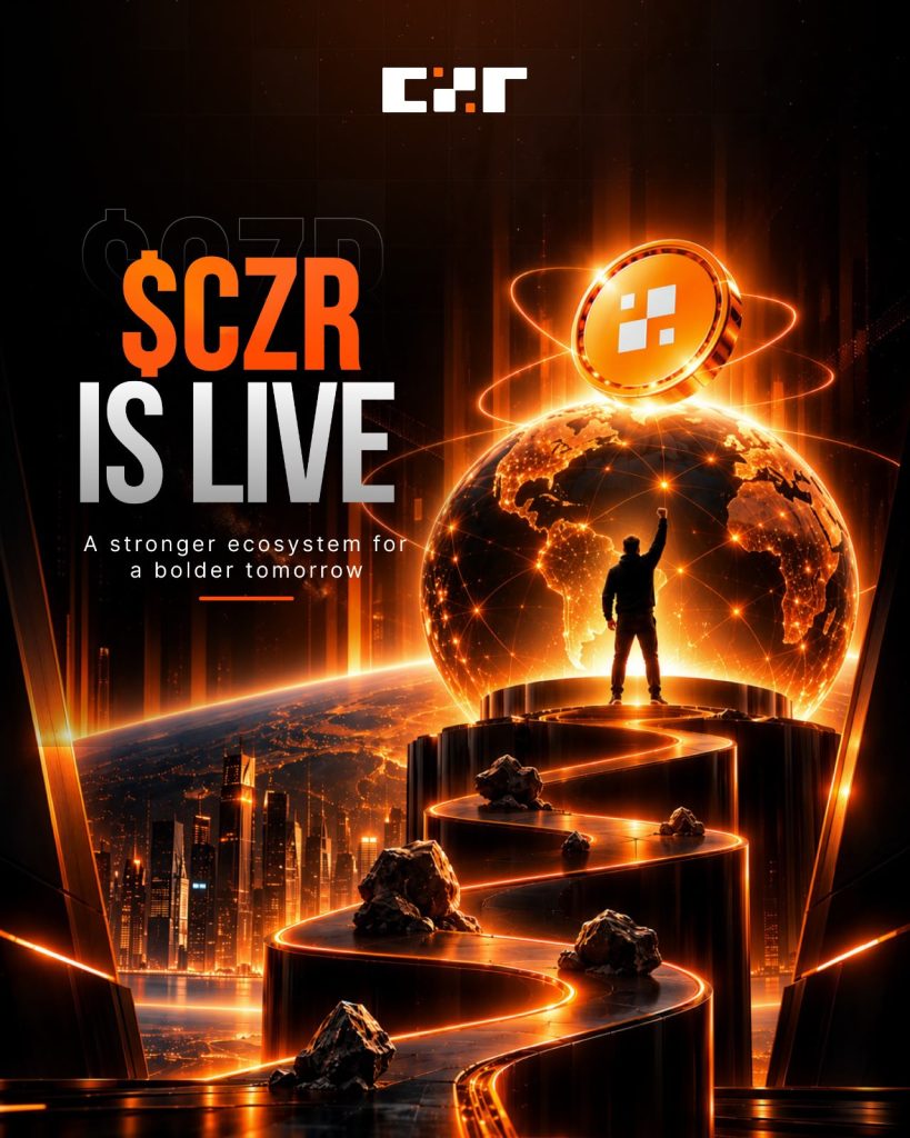 A promotional graphic reading "$CZR Is Live" on a dark background lit in orange. A glowing $CZR coin orbits a digital globe, and a figure stands atop a spiraling platform with a raised fist, overlooking a lit cityscape. The subhead reads "A stronger ecosystem for a bolder tomorrow," with the CZR logo at the top.